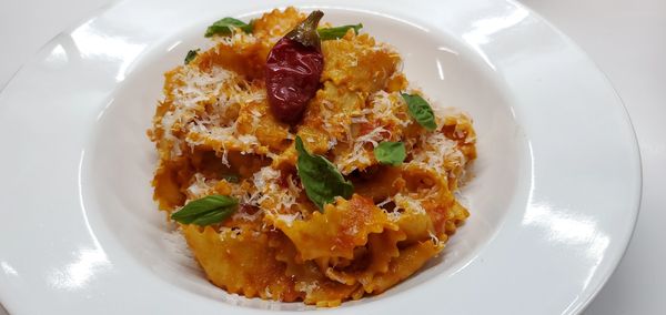 Homemade mafalde pasta arrabbiatta (which means "angry" in Italian).  Tomato, Calabrian  chili, parm