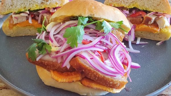 pan con chicharron crispy pork belly sandwich french bread salsa criolla aji amarillo sanguche