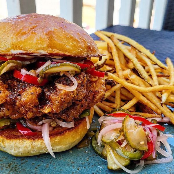 Nashville hot chicken sandwich.  House made pickles and fresh cut fries.