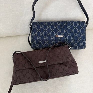 Two stylish Gucci handbags in blue and brown.
