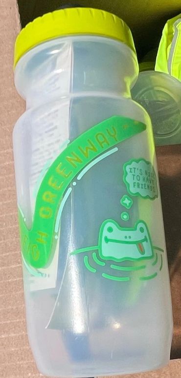 Clear water bottle with yellow lid and frog design.