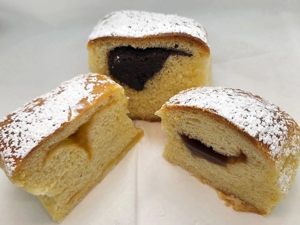  a picture of 3 sliced Buchty filled with apricot, poppy seed and plum filling respectivly