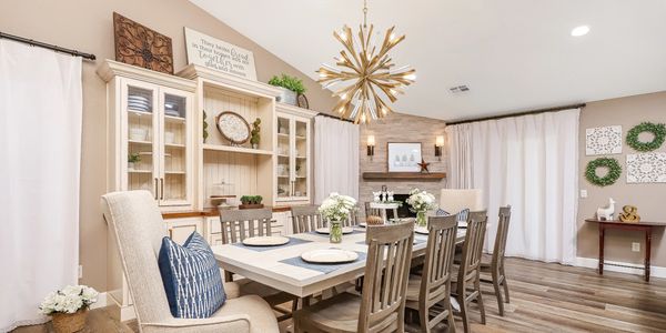 Bright dining room with rustic charm and modern lighting.