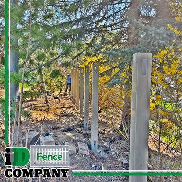 setup for fence installation, pine trees, outdoors. Nampa idaho fence installers