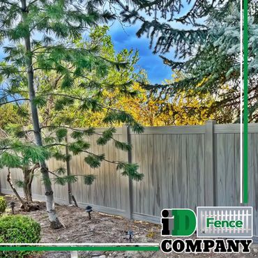 pine trees in backyard. vinyl fence that looks like wood. nampa idaho