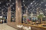 Cozy indoor space with warm lighting and wooden furniture.
