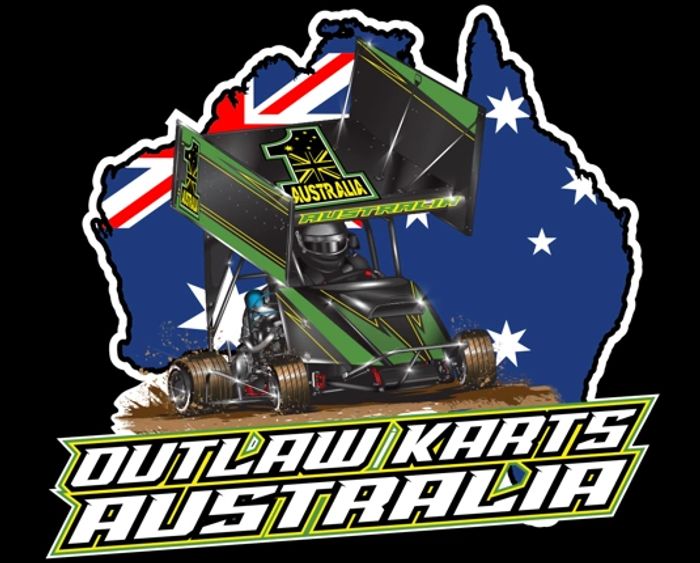 Black pencils in a gray holder next to a stack of white magazines with a camera in the background.