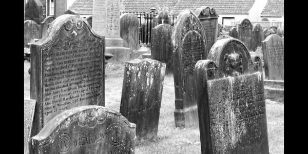 An ancient graveyard in the early morning.