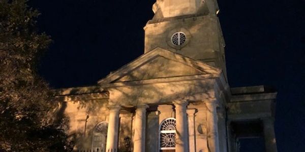 Historic St. Phillips Church at night.