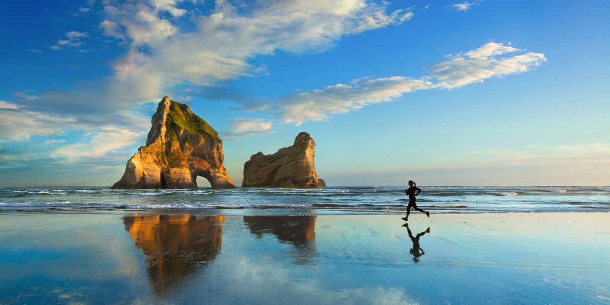 Healthy Woman running on beach