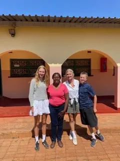 Lindsay Burch  (2nd from Right) with her daughter and son, and Sipiwe.