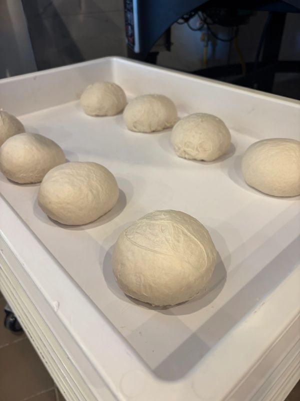 Preparing our freshly made dough balls for fermentation made from 00 Caupto flour from Naples, Italy
