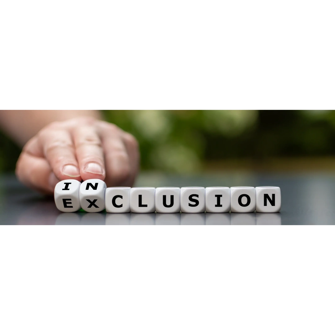 Hand flipping letter cubes between 'inclusion' and 'exclusion'.