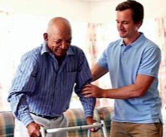 Picture of a worker helping a man on a walker