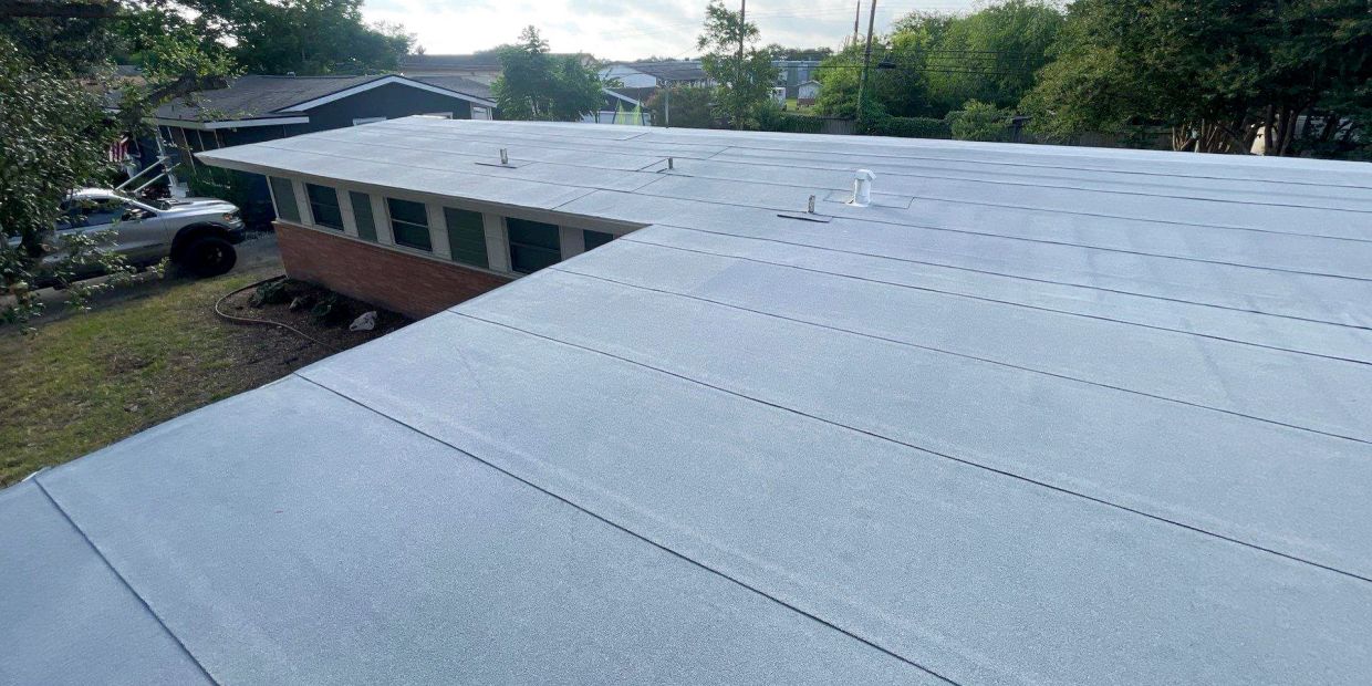 Newly coated flat roof on a building.