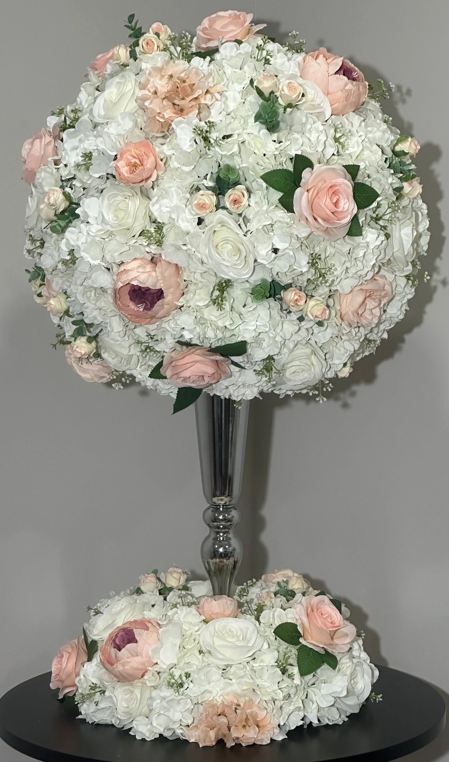  Contemporary Hydrangea arrangement with silver trumpet vase and wreath.  