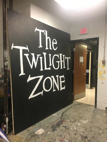 A large board with 'The Twilight Zone' written on it.