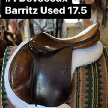 Close-up of a Devoucoux Barritz 17.5 saddle on a patterned saddle pad.