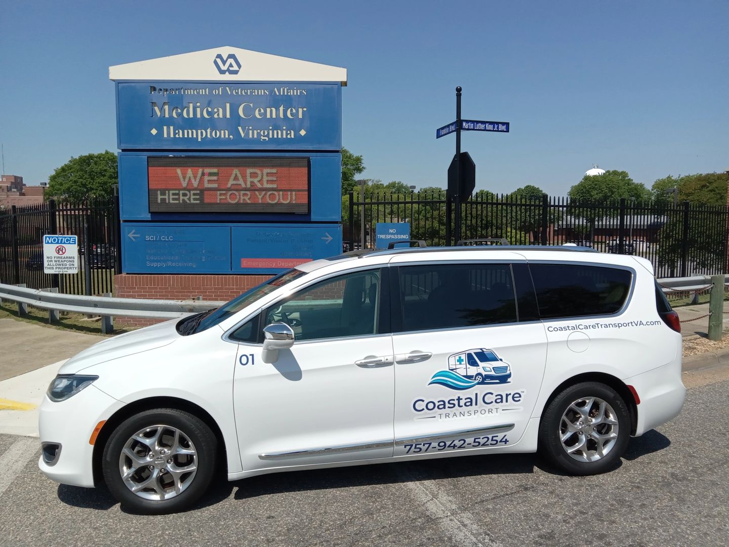 Coastal Care Transport driver assisting a senior veteran client