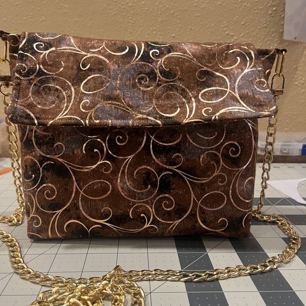 Medium Crossbody 
Brown and Gold whirls
added Gold Chain.