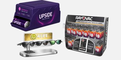 Display of Upside batteries, 4Life sunglasses, and Rayovac remote batteries.