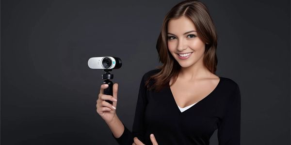 Happy model holding the Best Logitech digital camera in the hand