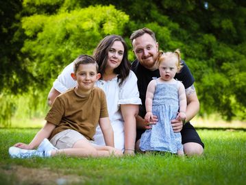 Family posing for photograph in Solihull. Family Photographer. 