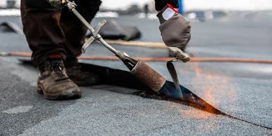 commercial flat roof, torch on roof completed by local roofing company in alberta roomis roofing