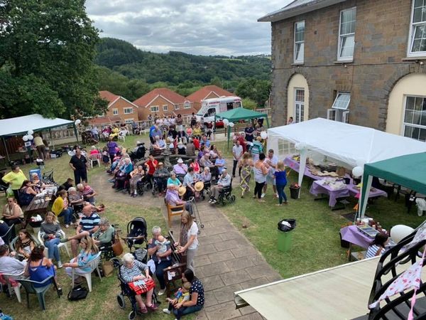 Community fete held in patio area behind Nursing home