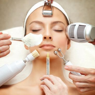 Woman receiving various facial treatments simultaneously.