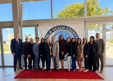 Group photo of officials at Palm Beach County event.