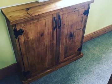 rustic wooden gas meter cupboard