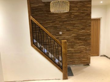 rustic wooden staircase with powder coated metal spindles
