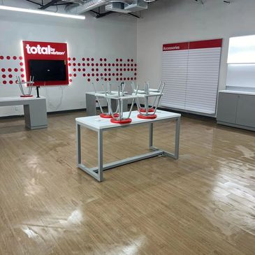 Empty Verizon store with chairs on tables.