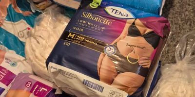 Various hygiene and incontinence products piled together.