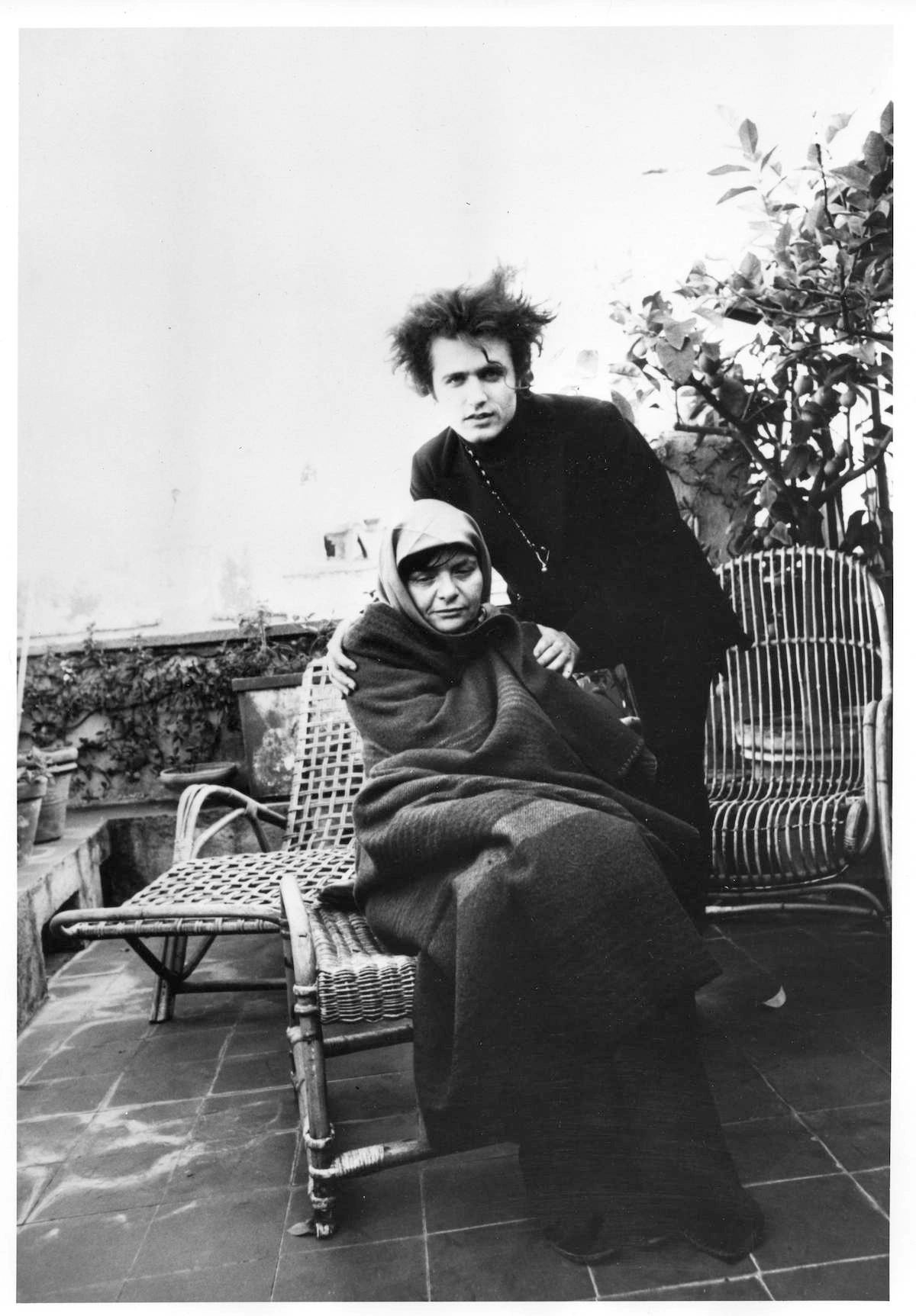 Gerard & and the novelist Elsa Morante on the rooftop balcony to her flat in the Via Del Oca, Rome, 1967. Photo by Patrizia Ruspoli/Courtesy of Gerard Malanga Personal Collection Gerard & and the novelist Elsa Morante on the rooftop balcony to her flat in the Via Del Oca, Rome, 1967. Photo by Patrizia Ruspoli/Courtesy of Gerard Malanga Personal Collection