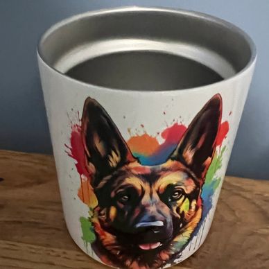 Colorful German Shepherd portrait on a white cylindrical container.
