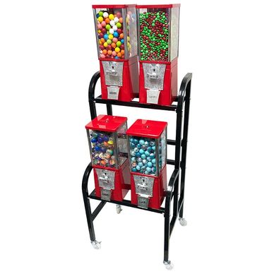 Four red gumball machines on a black metal stand with wheels.