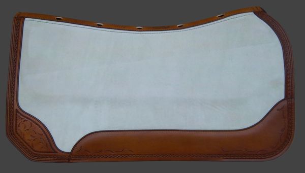 Brown and white saddle pad with leather details.