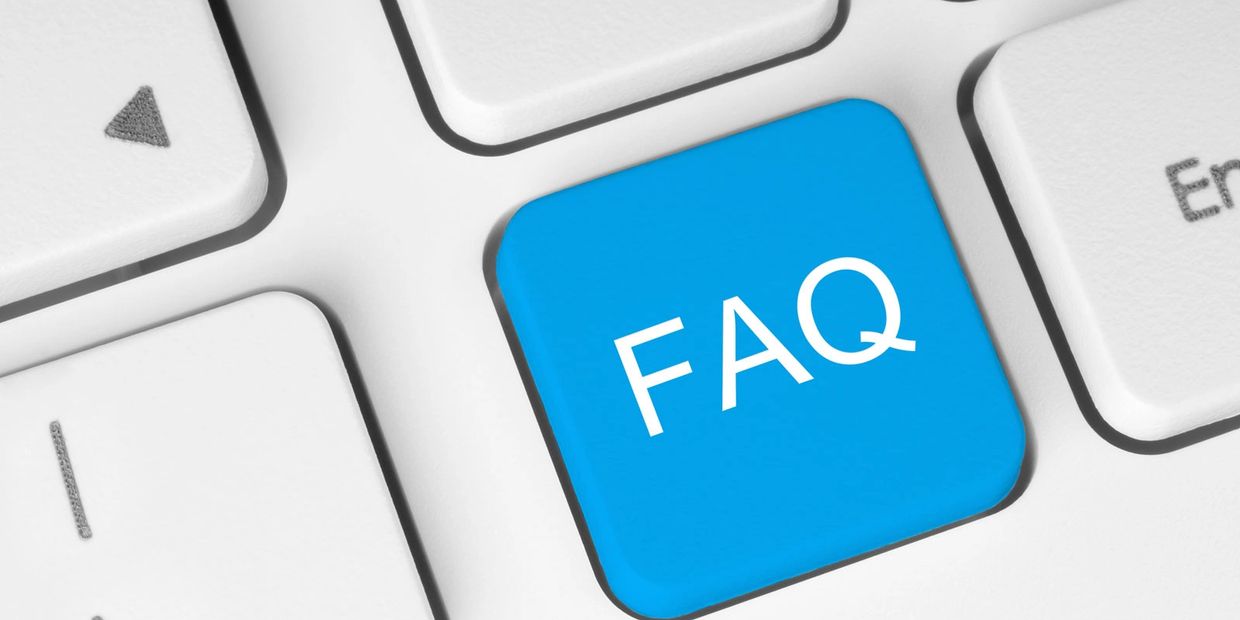 Blue FAQ key on a computer keyboard