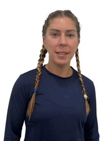 Woman with braided hair wearing a navy blue shirt.