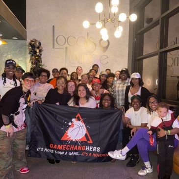Group photo of diverse women holding a GameChangers banner.