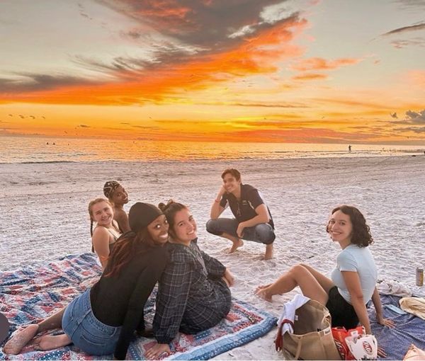 Alex Hatcher and classmates watching the sunset at the beach