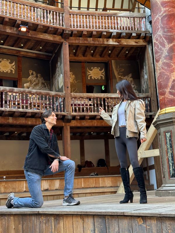 Alex Hatcher and Uri Zhang rehearsing a scene on the stage of Shakespeare's Globe in London