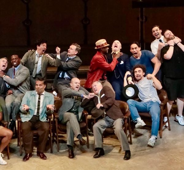 Cast of Twelve Angry Men performing a stage fight