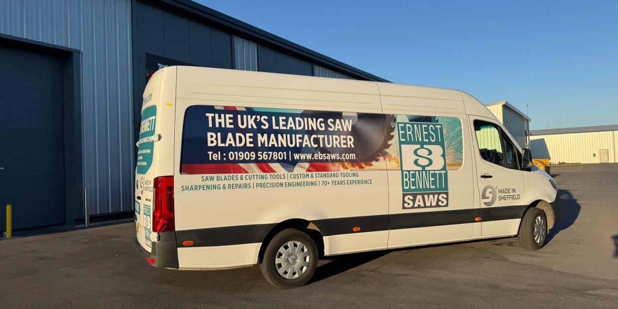 Ernest Bennett Saws delivery van parked outside a warehouse.