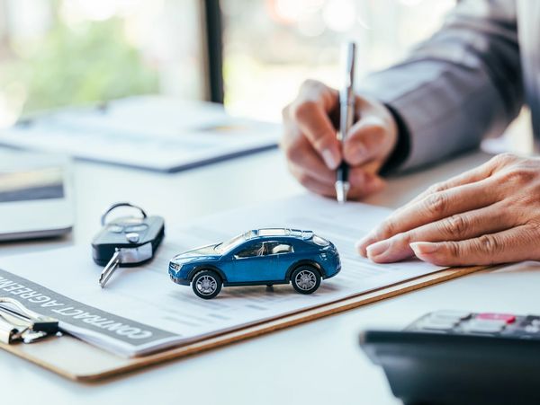Signing a contract for buying a car