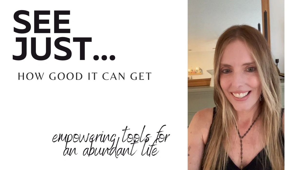 Smiling woman promoting empowerment and abundance with a positive message.