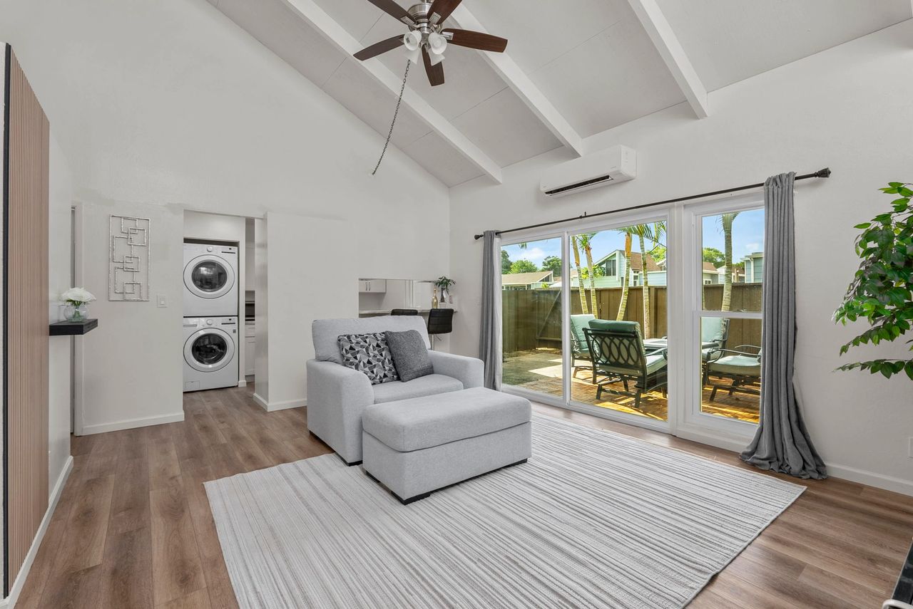 Lanikuhana Patio Homes Unit 1060 view of living room, laundry, and lanai,
