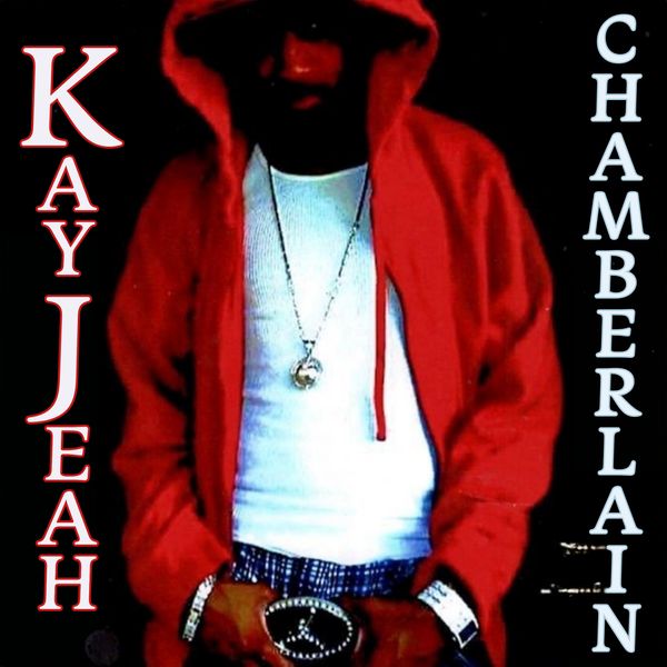 Person in red hoodie with white shirt and jewelry, text 'Kay Jeah Chamberlain' on sides.